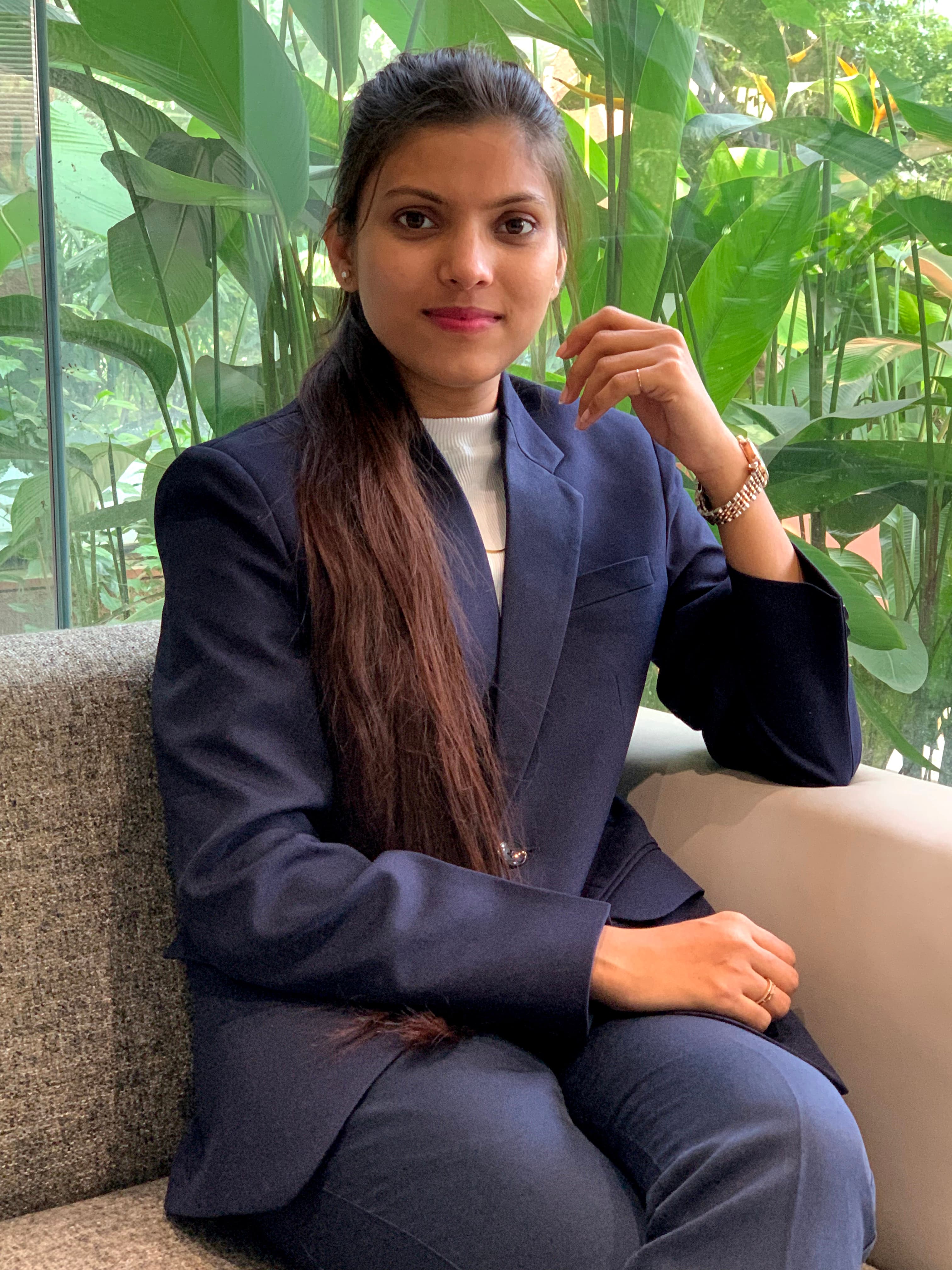 Kumud Waykole working at a multi-monitor development setup